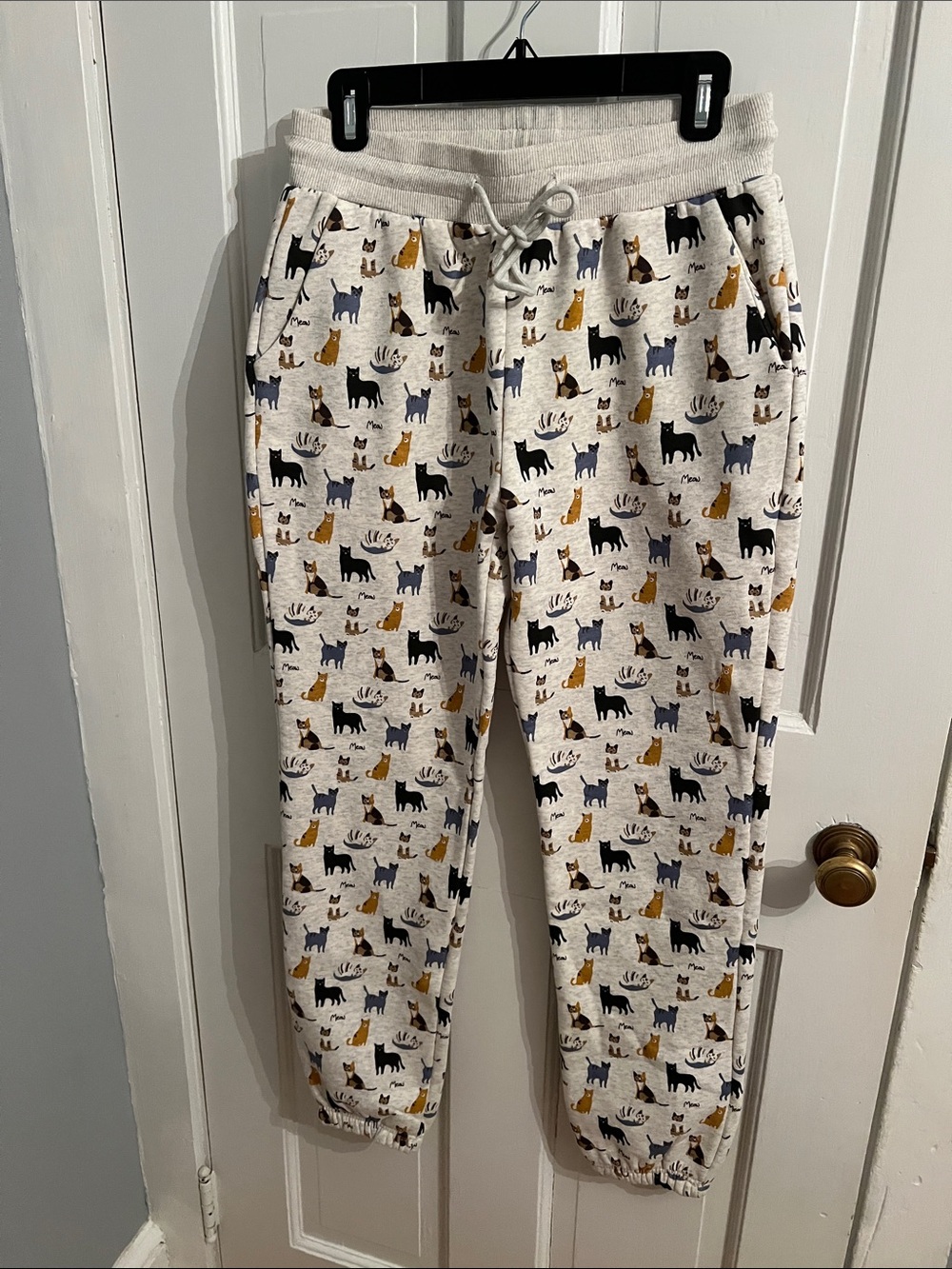 Cream Cat-Print Jogger Pants with Drawstring Waist
